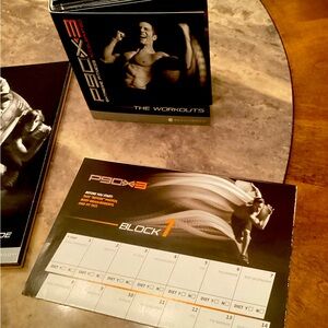 P90X Beachbody work out dvds/fitness guide, along with planner .